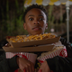 Kenny holding nachos and pop corn.